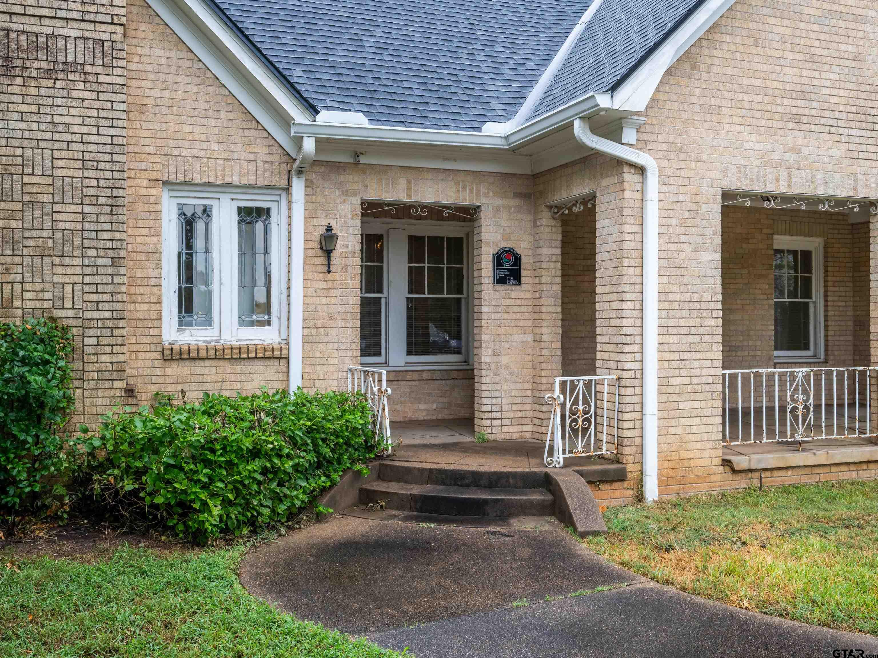 201 West Rusk Street Tyler, TX 75701 - Photo 6 of 30 a front view of a house with a yard