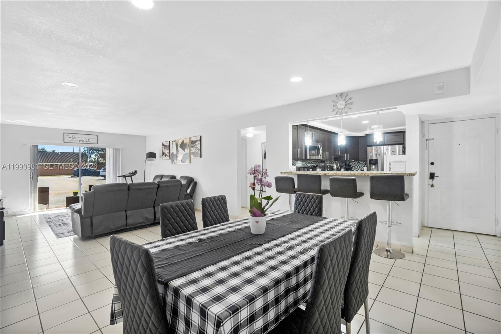 9403 Southwest 76th Street, Unit Y17 Miami, FL 33173 - Photo 12 of 30 a view of a dining room with furniture