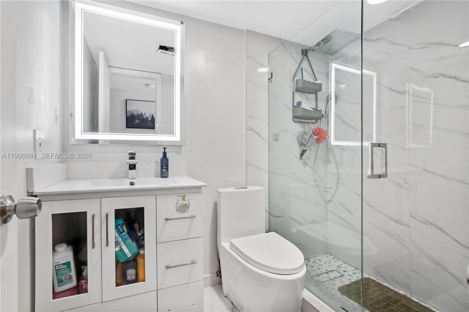 9403 Southwest 76th Street, Unit Y17 Miami, FL 33173 - Photo 16 of 30 a bathroom with a sink toilet and shower