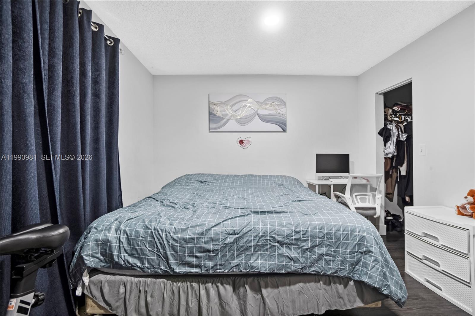 9403 Southwest 76th Street, Unit Y17 Miami, FL 33173 - Photo 18 of 30 a bedroom with a bed and a flat screen tv
