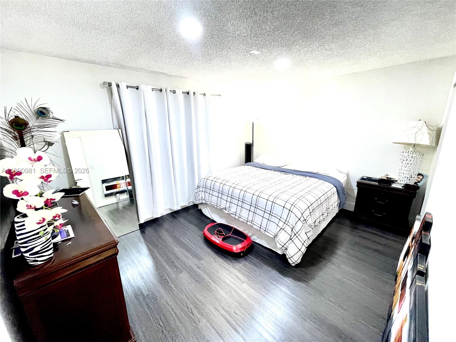 9403 Southwest 76th Street, Unit Y17 Miami, FL 33173 - Photo 20 of 30 a bedroom with a bed and a dresser