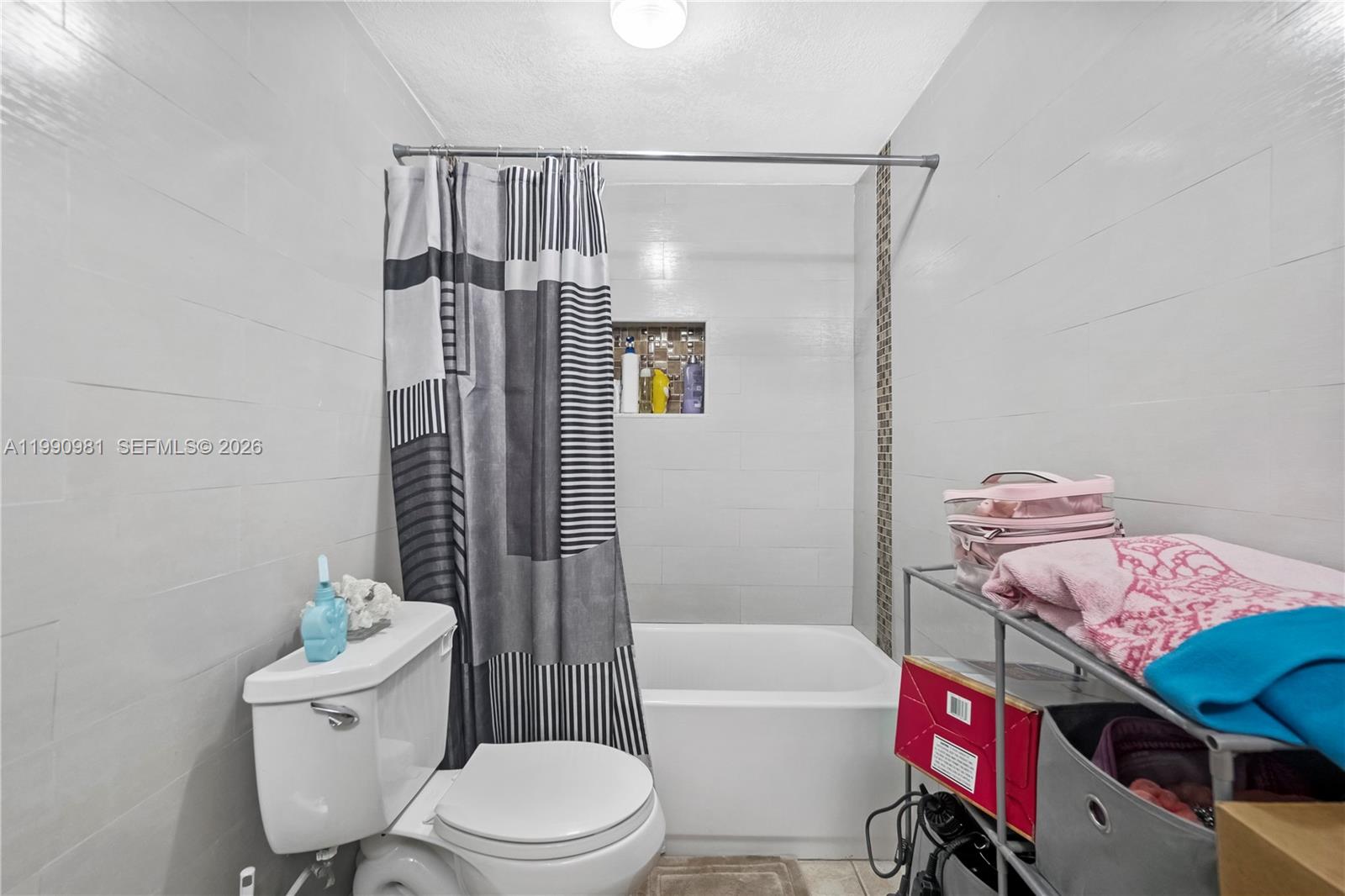 9403 Southwest 76th Street, Unit Y17 Miami, FL 33173 - Photo 23 of 30 a bathroom with a toilet and a shower