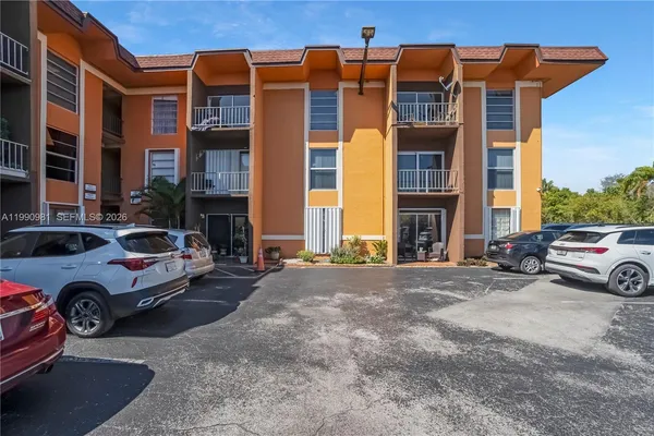 a view of a car parked in front of a building