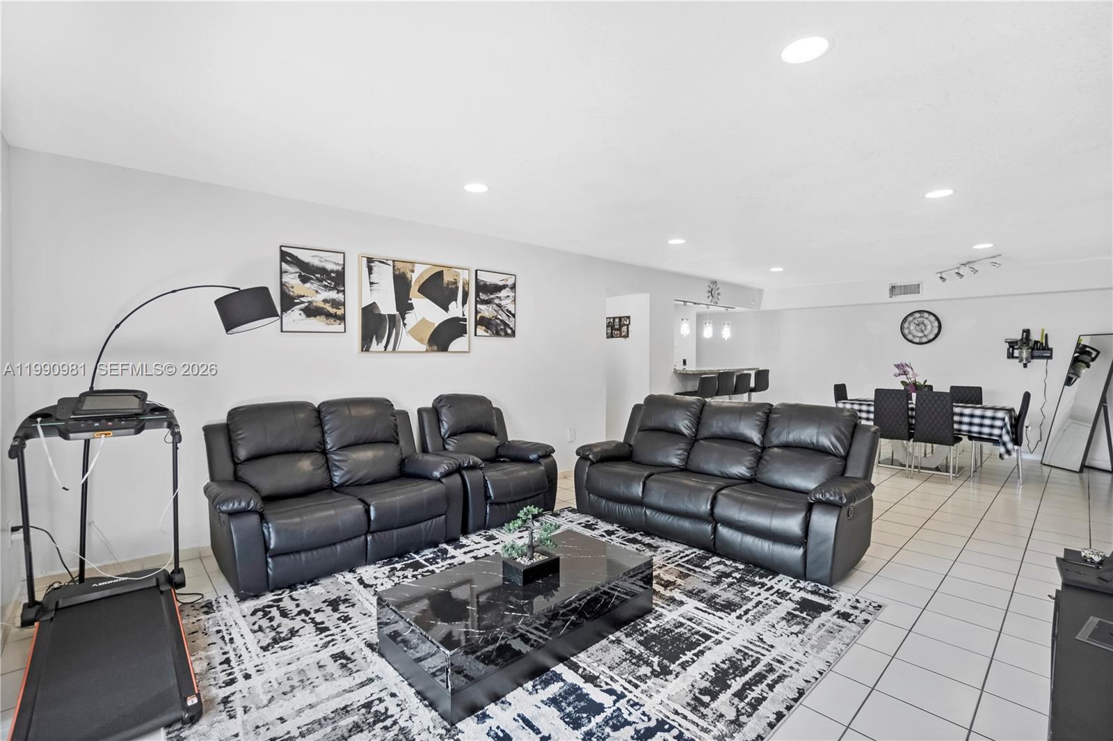 9403 Southwest 76th Street, Unit Y17 Miami, FL 33173 - Photo 6 of 30 a living room with furniture and wooden floor