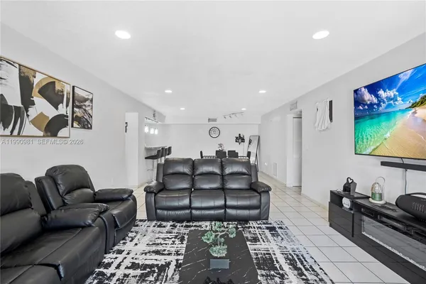 a living room with furniture and a rug