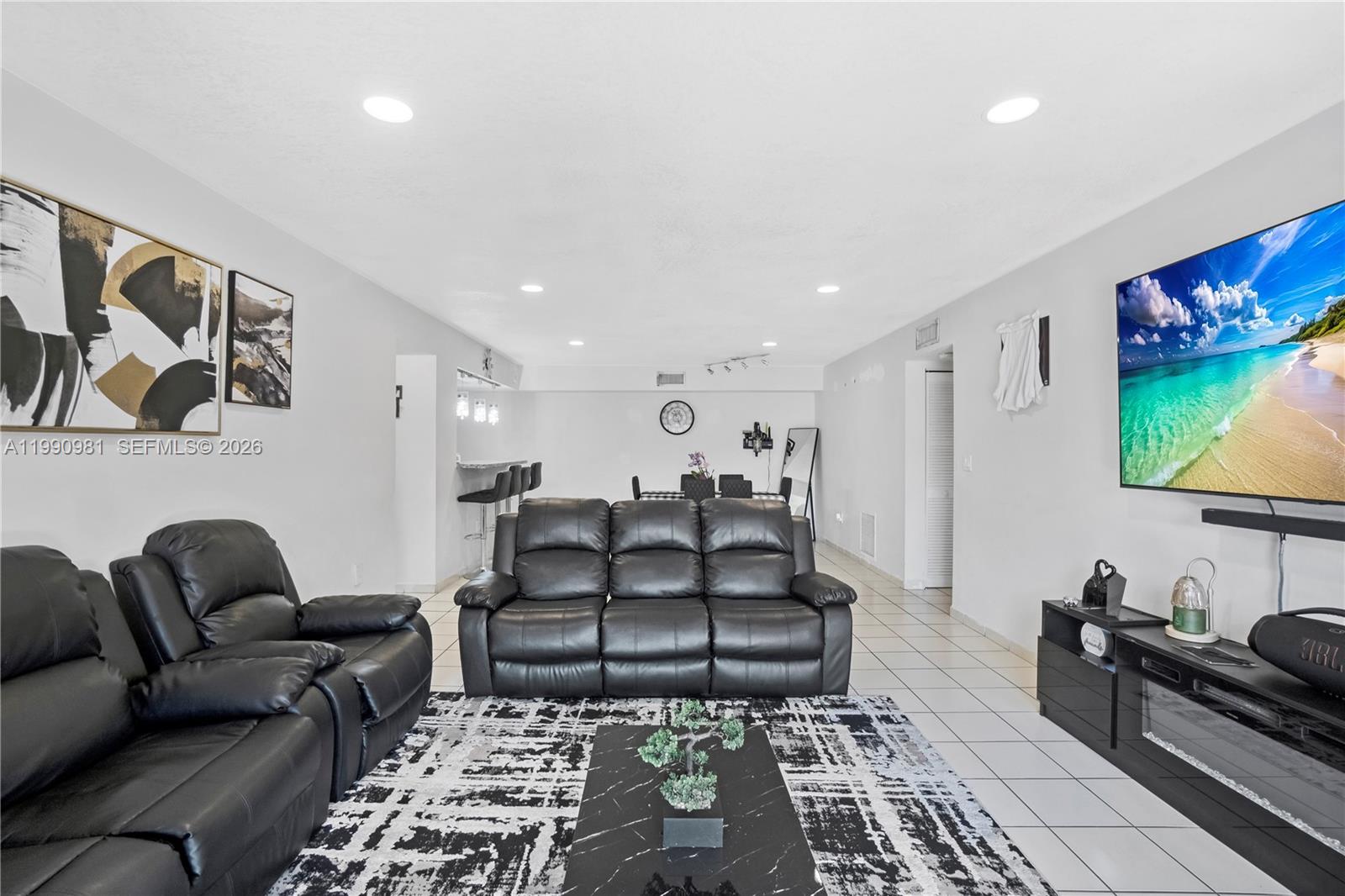 9403 Southwest 76th Street, Unit Y17 Miami, FL 33173 - Photo 7 of 30 a living room with furniture and a rug