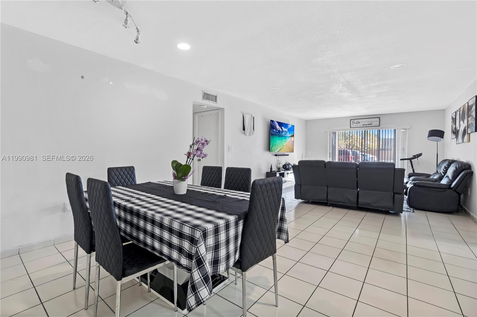 9403 Southwest 76th Street, Unit Y17 Miami, FL 33173 - Photo 9 of 30 a living room with furniture and a flat screen tv