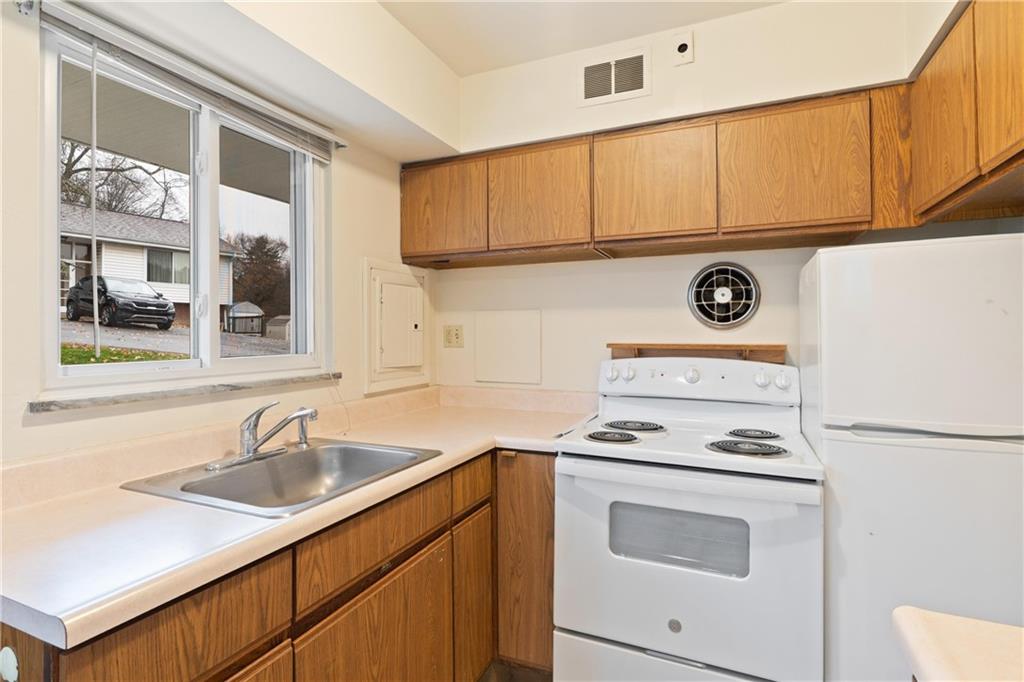 718 West Ingomar Road, Unit 2 Pittsburgh, PA 15237 - Photo 4 of 10 a kitchen with appliances cabinets and a sink