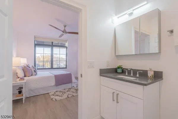 a bedroom with a bed and a table in it