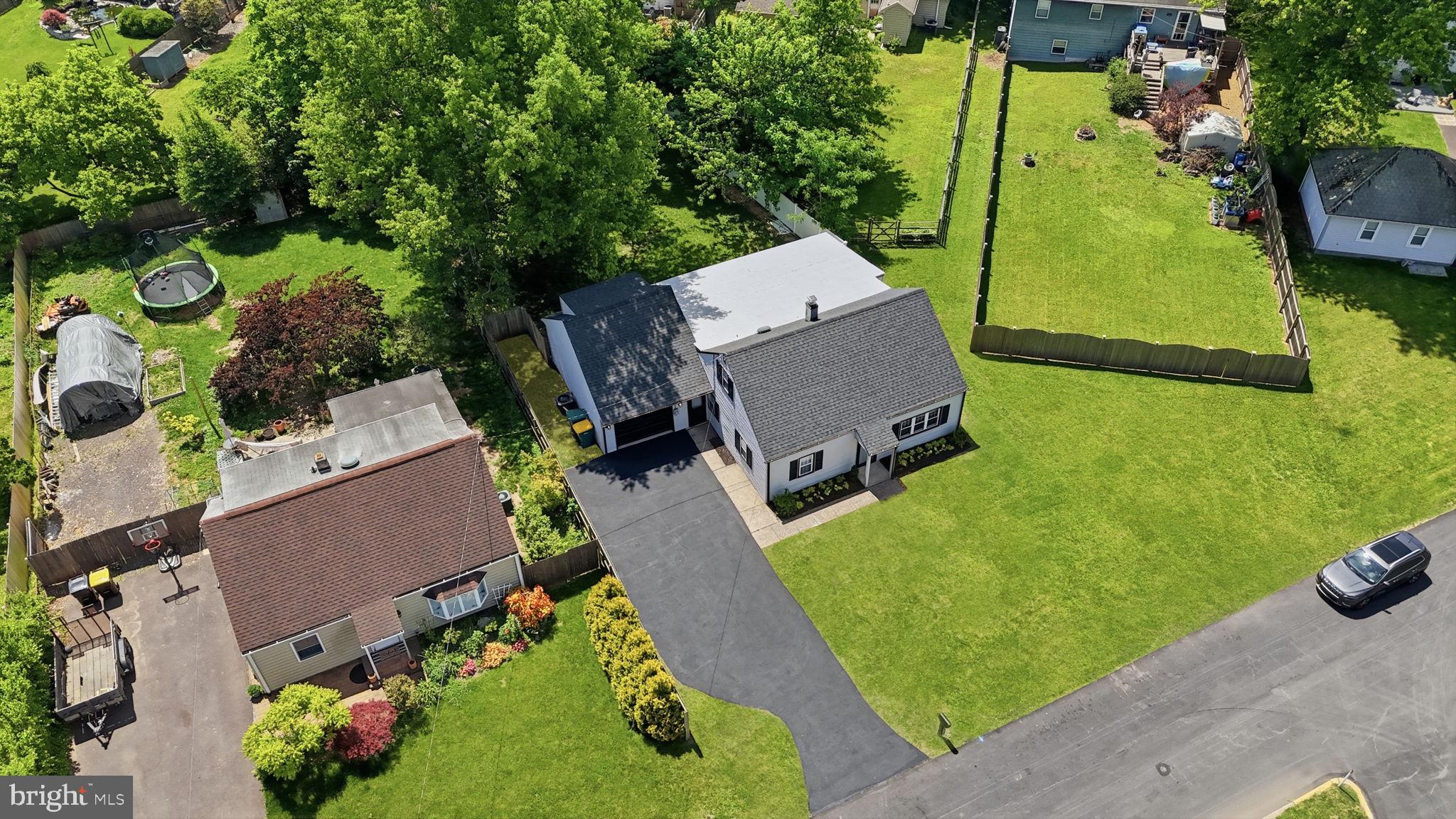 340 West Broad Street Hatfield, PA 19440 - Photo 5 of 55 an aerial view of a house with a swimming pool