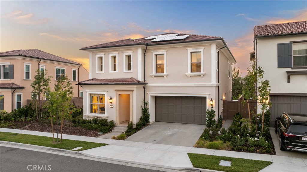 63 Longchamp Irvine Ca Irvine, CA 92602 - Photo 1 of 75 a front view of a house with garden