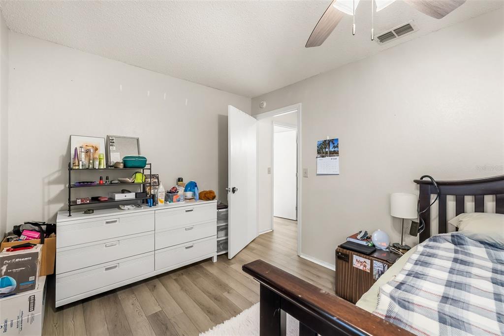 3705 Southwest 27th Street, Unit 615 Gainesville, FL 32608 - Photo 17 of 27 a room with a bed and a desk