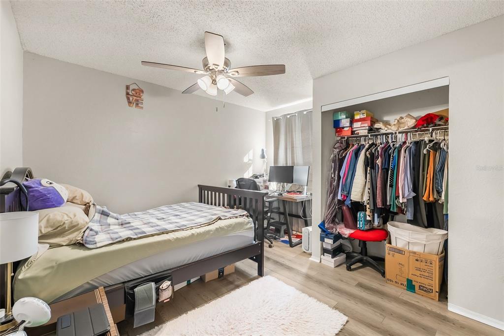 3705 Southwest 27th Street, Unit 615 Gainesville, FL 32608 - Photo 18 of 27 a bedroom with a bed and a closet