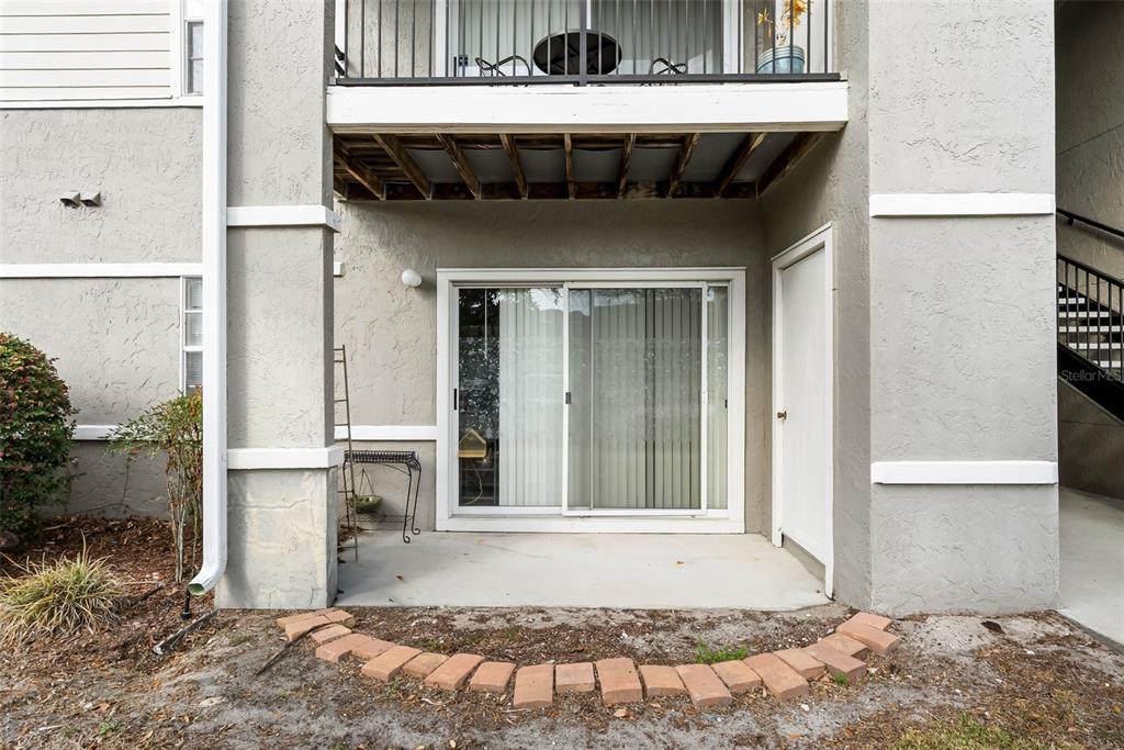 3705 Southwest 27th Street, Unit 615 Gainesville, FL 32608 - Photo 2 of 27 a view of a porch with a table and chairs