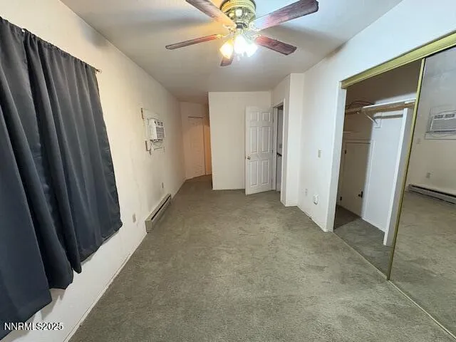 a view of a hallway with a chandelier fan