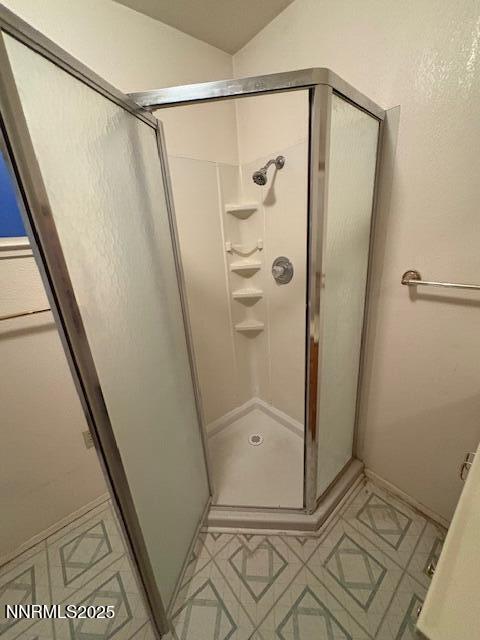 950 H Street Hawthorne, NV 89415 - Photo 14 of 26 a bathroom with a glass shower door and a sink