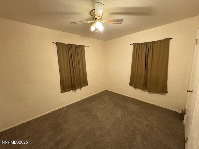 950 H Street Hawthorne, NV 89415 - Photo 17 of 26 an empty room with windows and fan