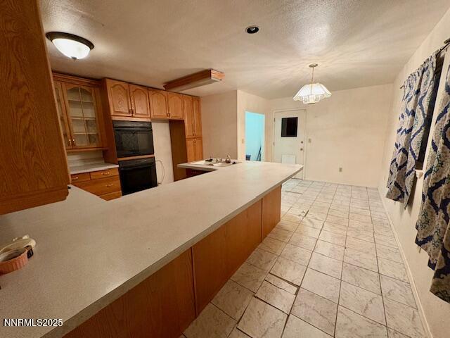 950 H Street Hawthorne, NV 89415 - Photo 21 of 26 a large kitchen with a large counter top appliances and cabinets
