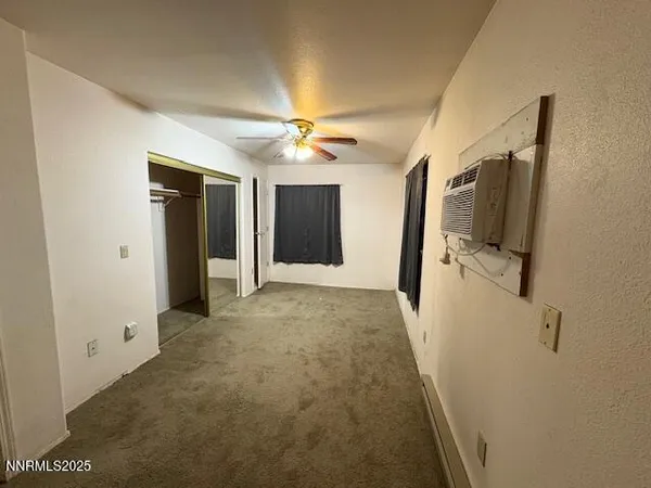 a view of a hallway with a bathroom