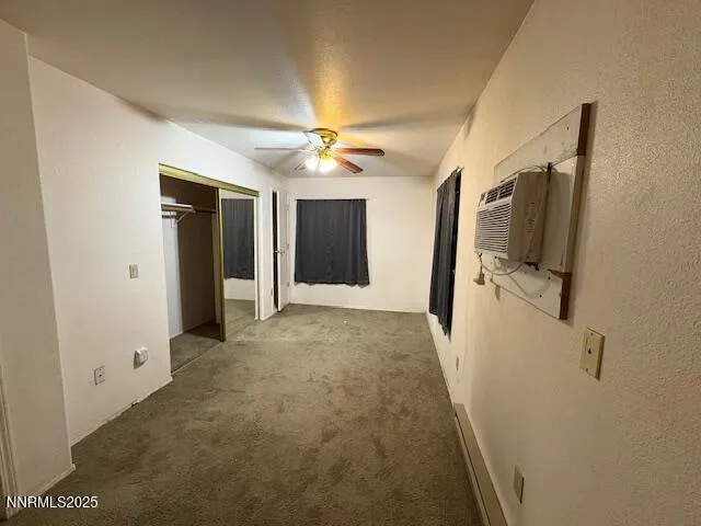 a view of a hallway with a bathroom