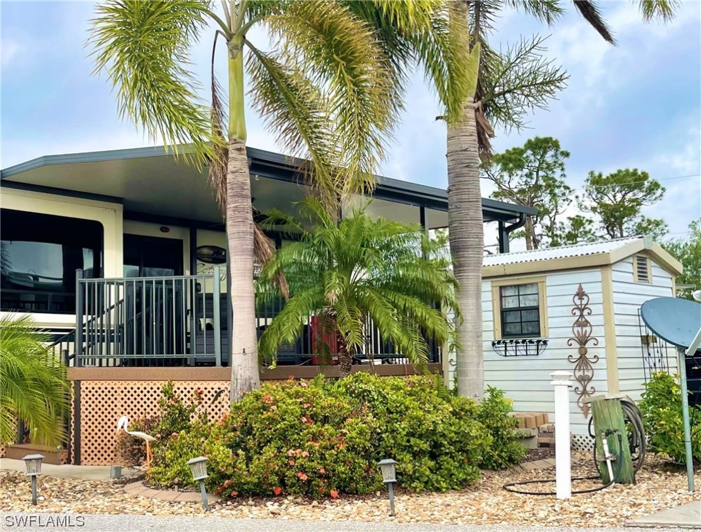 6800 Golf Course Boulevard, Unit E29 Punta Gorda, FL 33982 - Photo 2 of 23 a front view of a house with a yard
