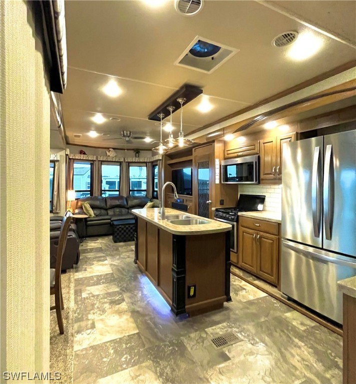 6800 Golf Course Boulevard, Unit E29 Punta Gorda, FL 33982 - Photo 6 of 23 a kitchen with a refrigerator and a stove