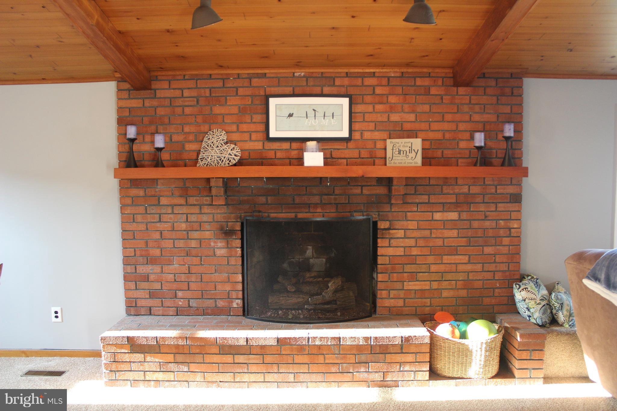 222 Dale Road Pasadena, MD 21122 - Photo 11 of 28 Brick gas fireplace w/hearth.