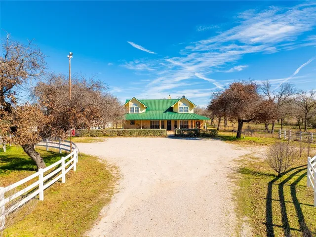 a swimming pool with outdoor seating and yard