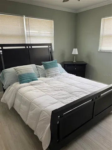 a bedroom with a bed and a dresser