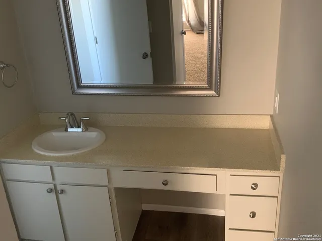a bathroom with a sink and a mirror