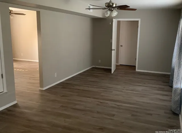 a view of a livingroom with wooden floor