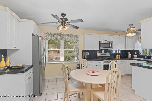 a view of kitchen with breakfast area