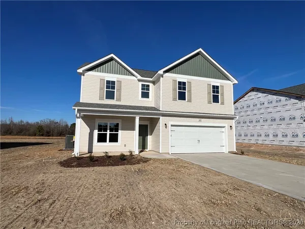 a view of house and yard