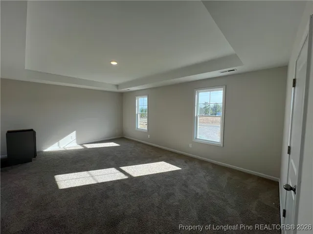 a view of empty room with windows