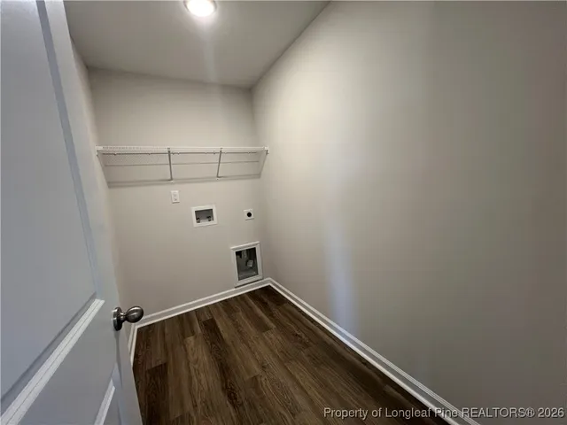 a view of storage and utility room with racks on the wall