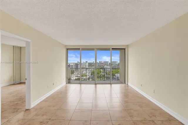 a view of a walk in closet and a bathroom