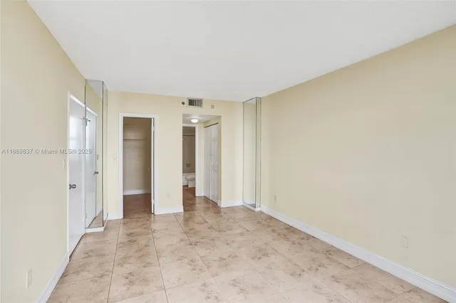 a view of a hallway with a refrigerator