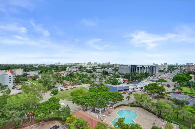 an aerial view of multiple houses with yard