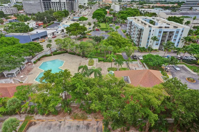 a view of a swimming pool with a yard
