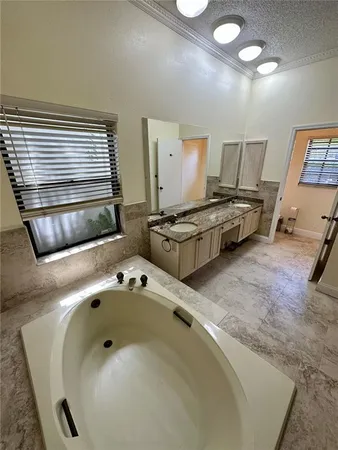 a en suite bathroom with a sink and mirror