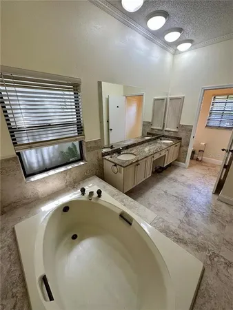 a en suite bathroom with a sink and mirror