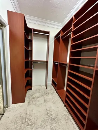 a view of closet area with empty racks