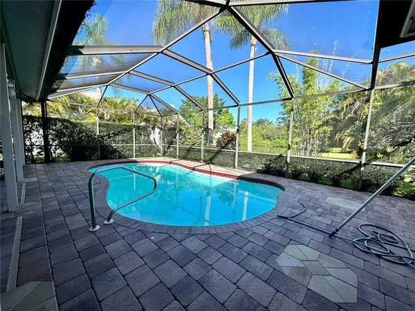 a view of a swimming pool with a patio