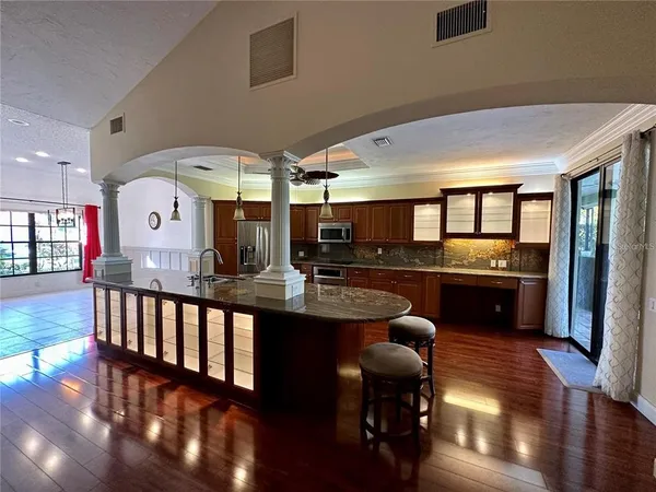 a lobby with furniture and wooden floor
