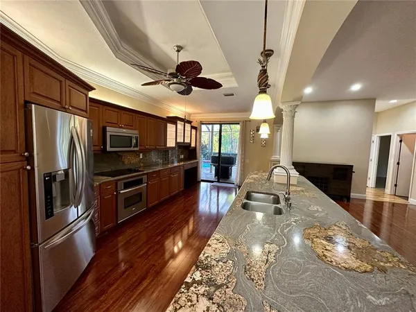 a large kitchen with stainless steel appliances