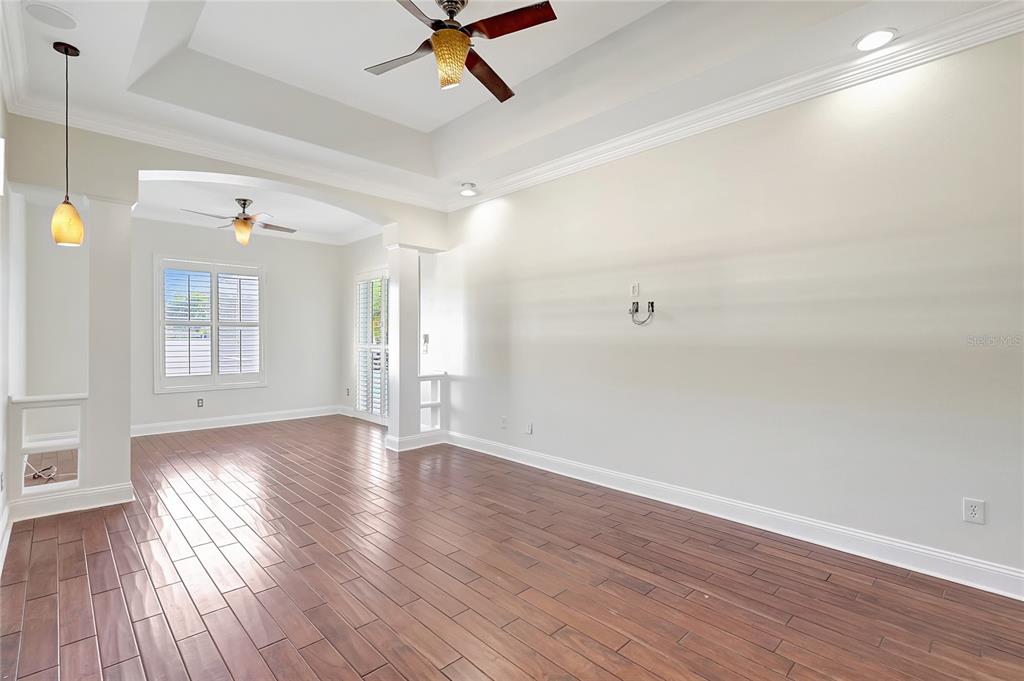2863 Duncan Tree Circle Valrico, FL 33594 - Photo 41 of 53 a view of an empty room with wooden floor and a window