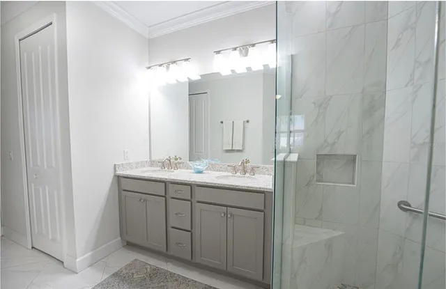 a bathroom with a double vanity sink and mirror