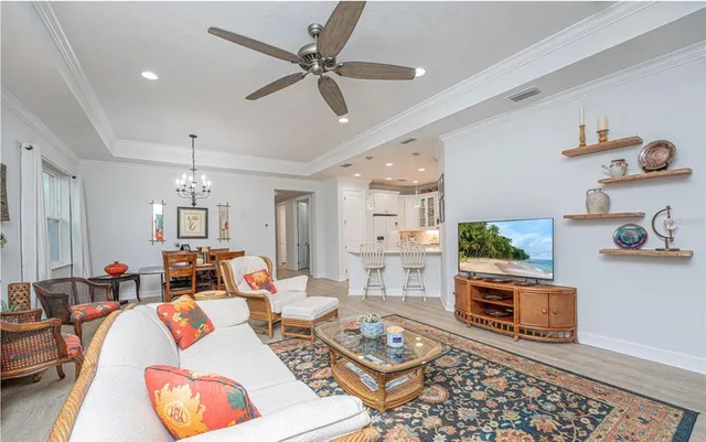 a living room with furniture fireplace and a window