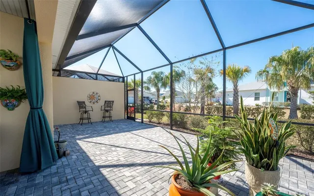 a bedroom with furniture and a potted plant