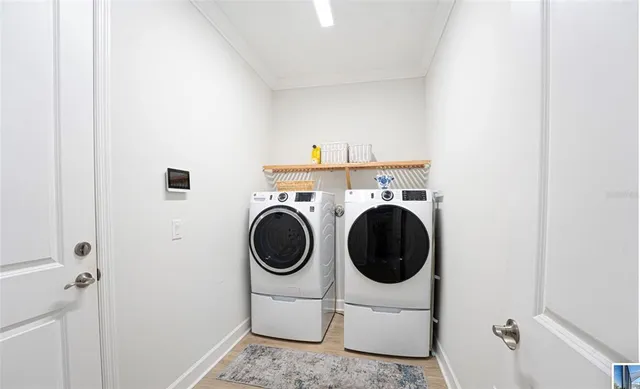 an aerial view of a house with a swimming pool